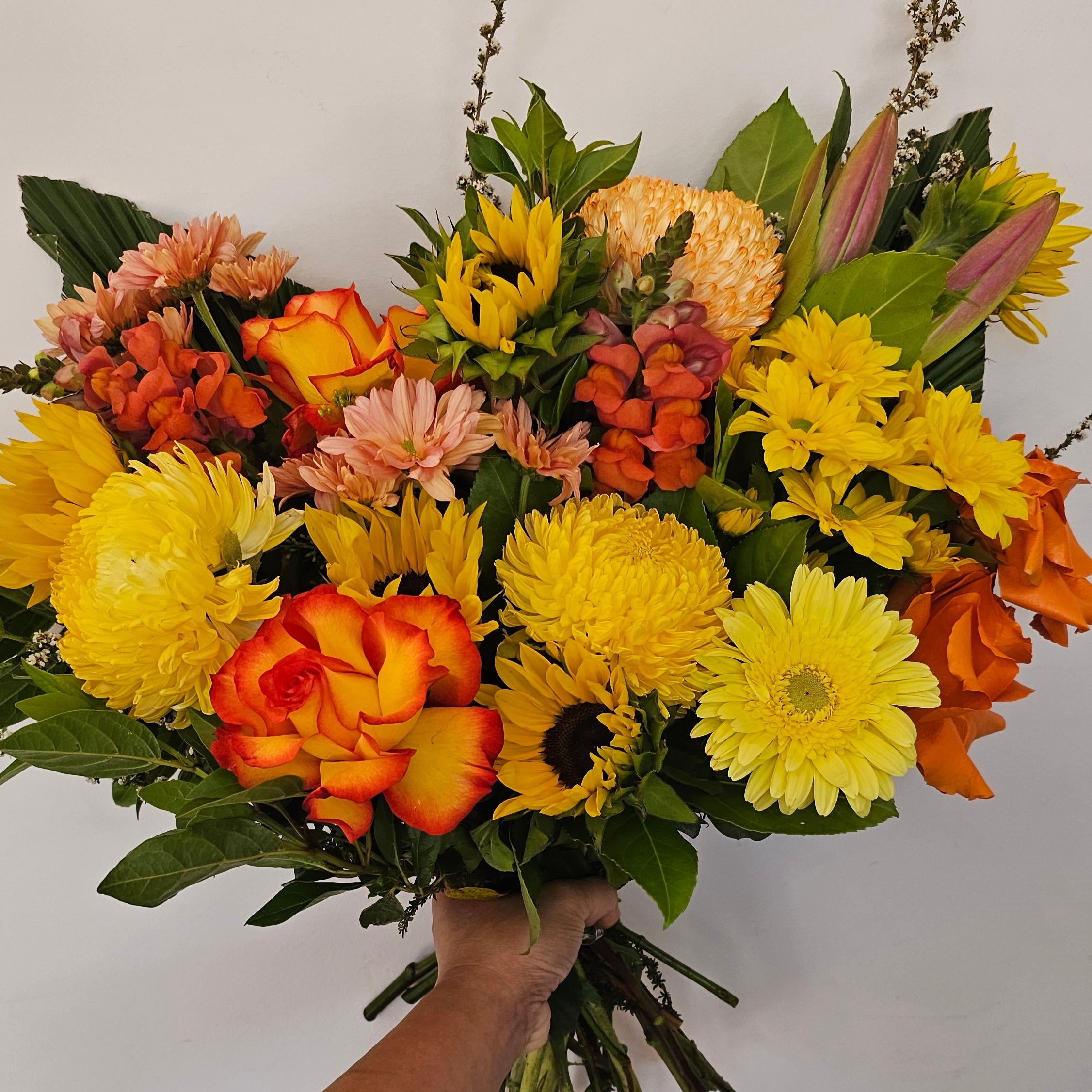 A bouquet with warm tones like yellow, orange and red blooms this flower bouquet is available for same day delivery from The Flower boutique Perth who is an expert florist