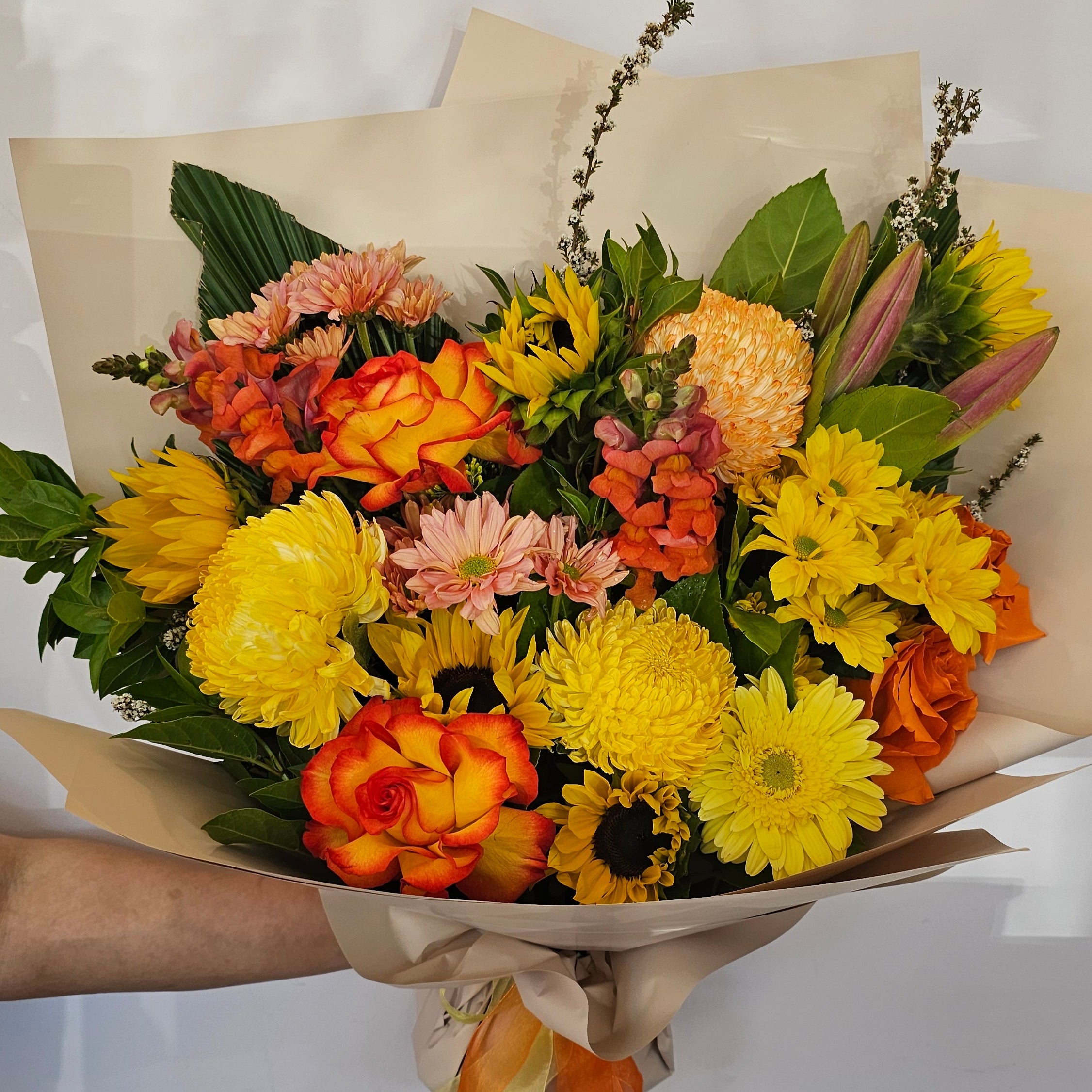 A bouquet with warm tones like yellow, orange and red blooms this flower bouquet is available for same day delivery from The Flower boutique Perth who is an expert florist