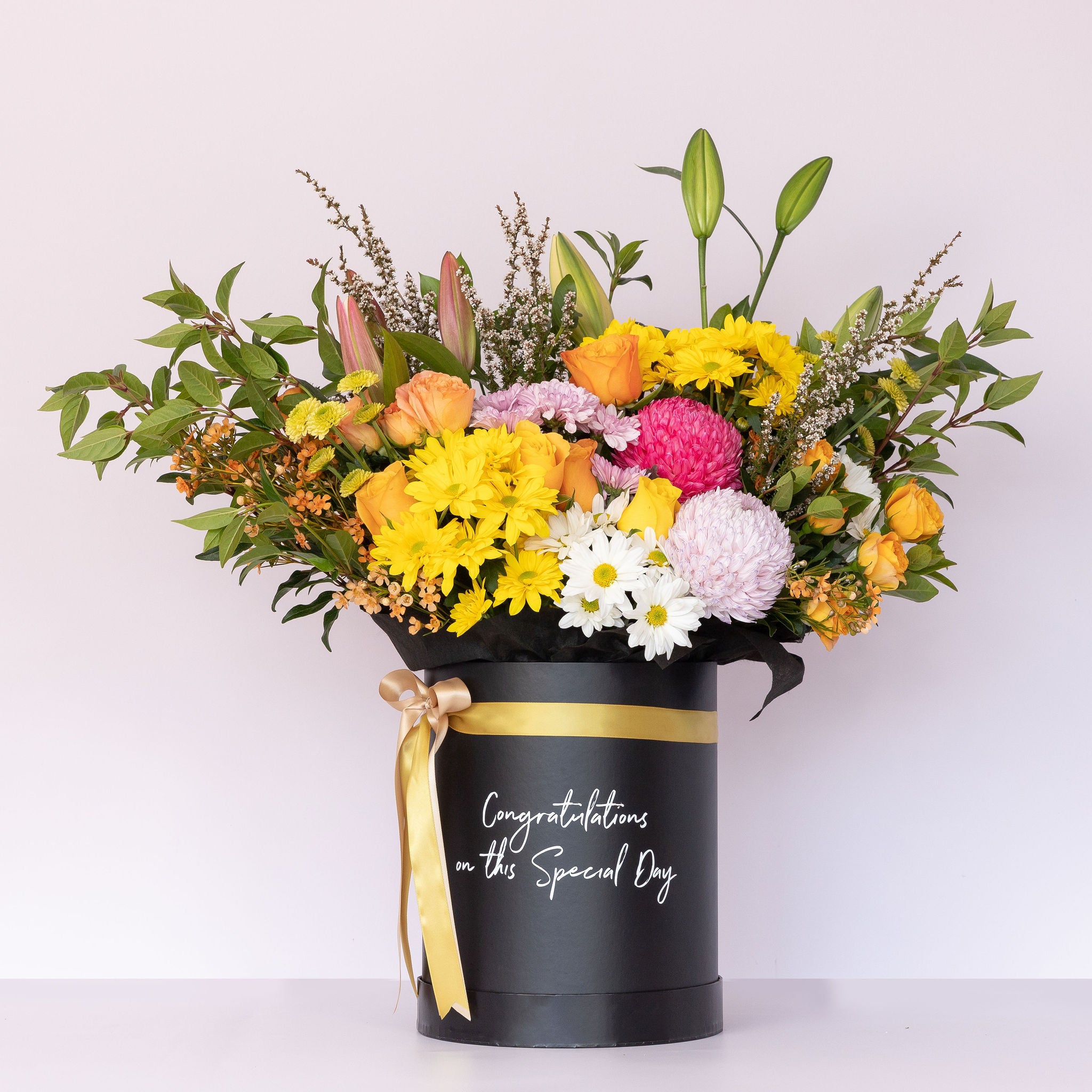 Congratulations keepsake flower box with bright & colourful tones, featuring elegant blooms in a customizable gift box.