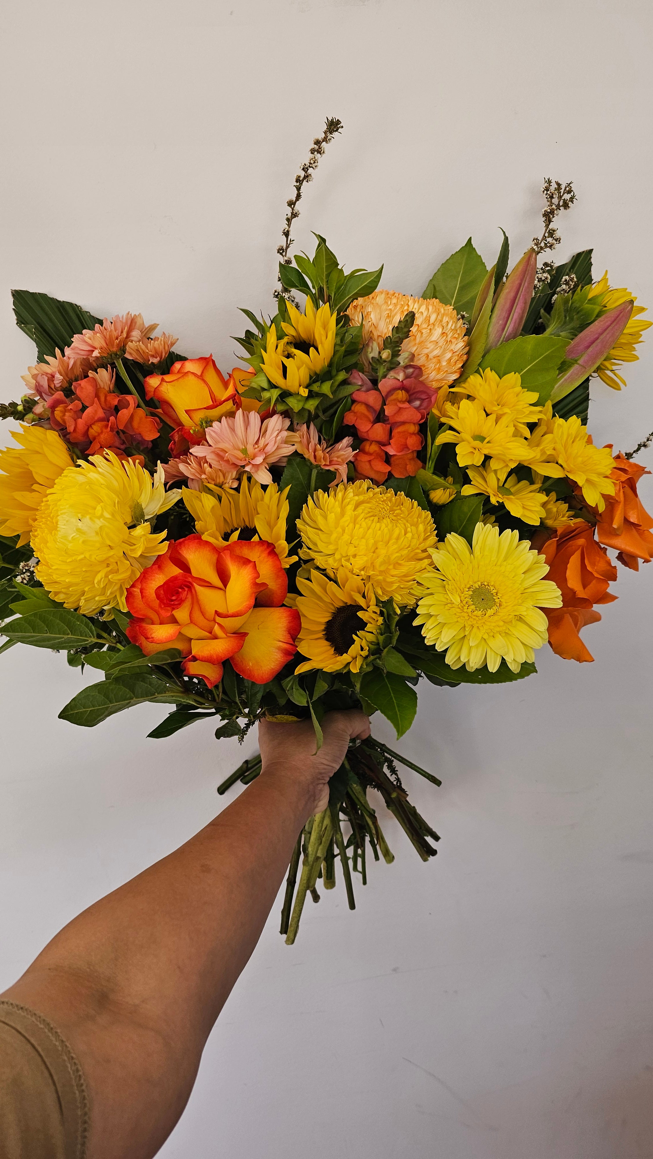 A bouquet with warm tones like yellow, orange and red blooms this flower bouquet is available for same day delivery from The Flower boutique Perth who is an expert florist