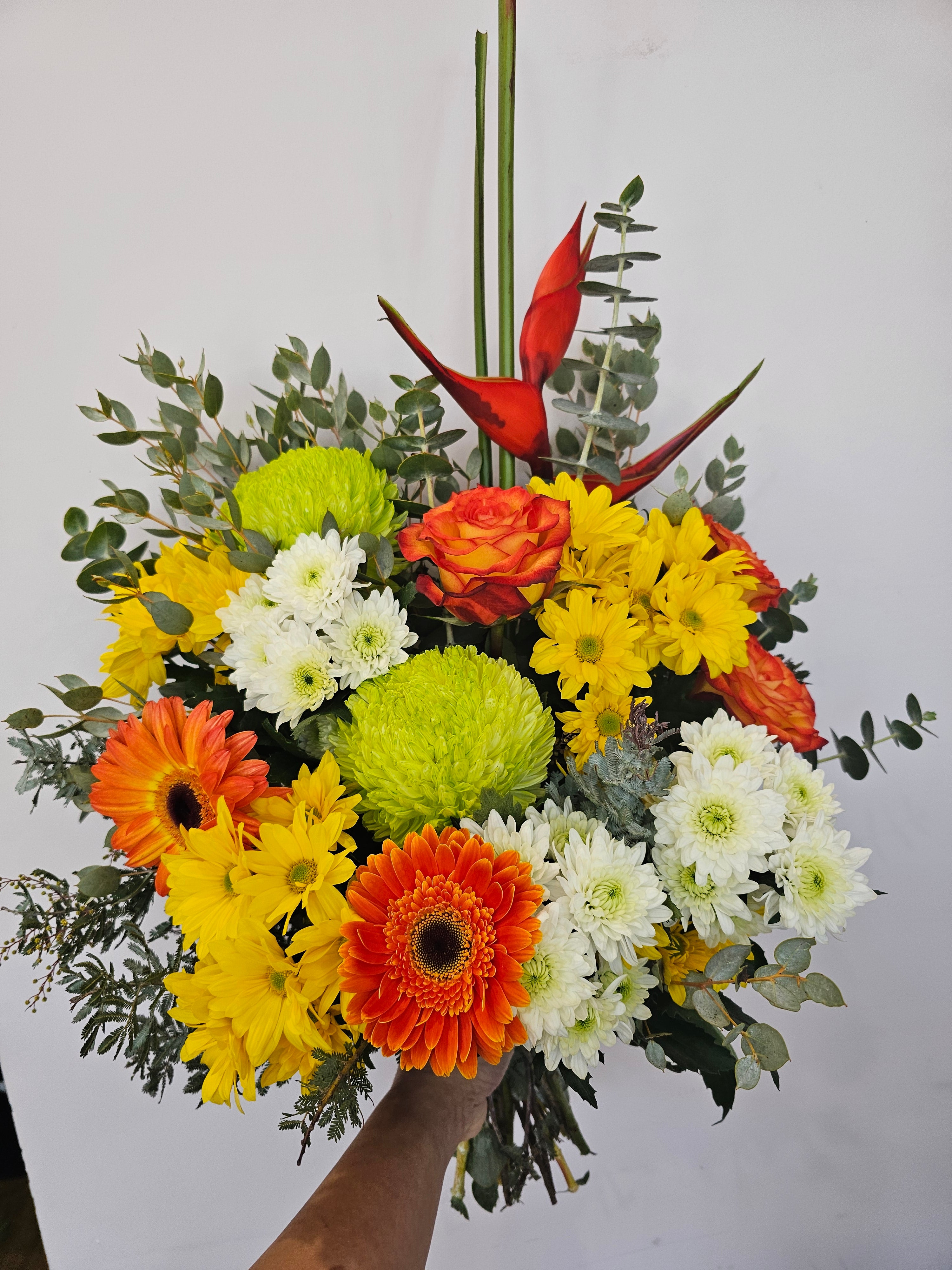 Bright yellow and orange flower bouquet featuring seasonal blooms, hand-crafted by expert florists, perfect for delivery in Perth, Western Australia.