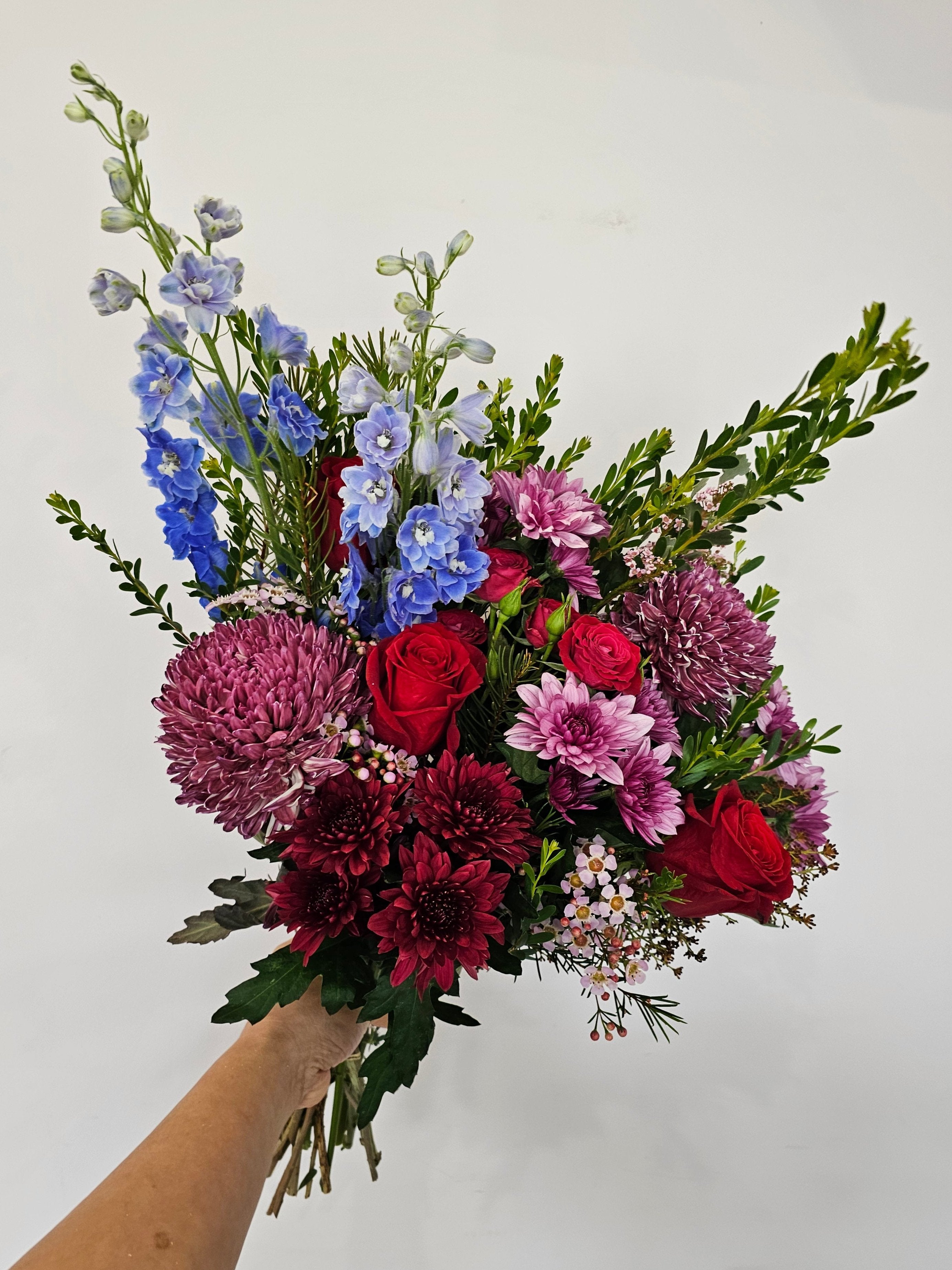 Midnight Velvet bouquet featuring dark berry tones with rich reds, purples, dark pinks, and a touch of blue. Includes roses, dahlias, and lilies, available for delivery in Perth, Western Australia.