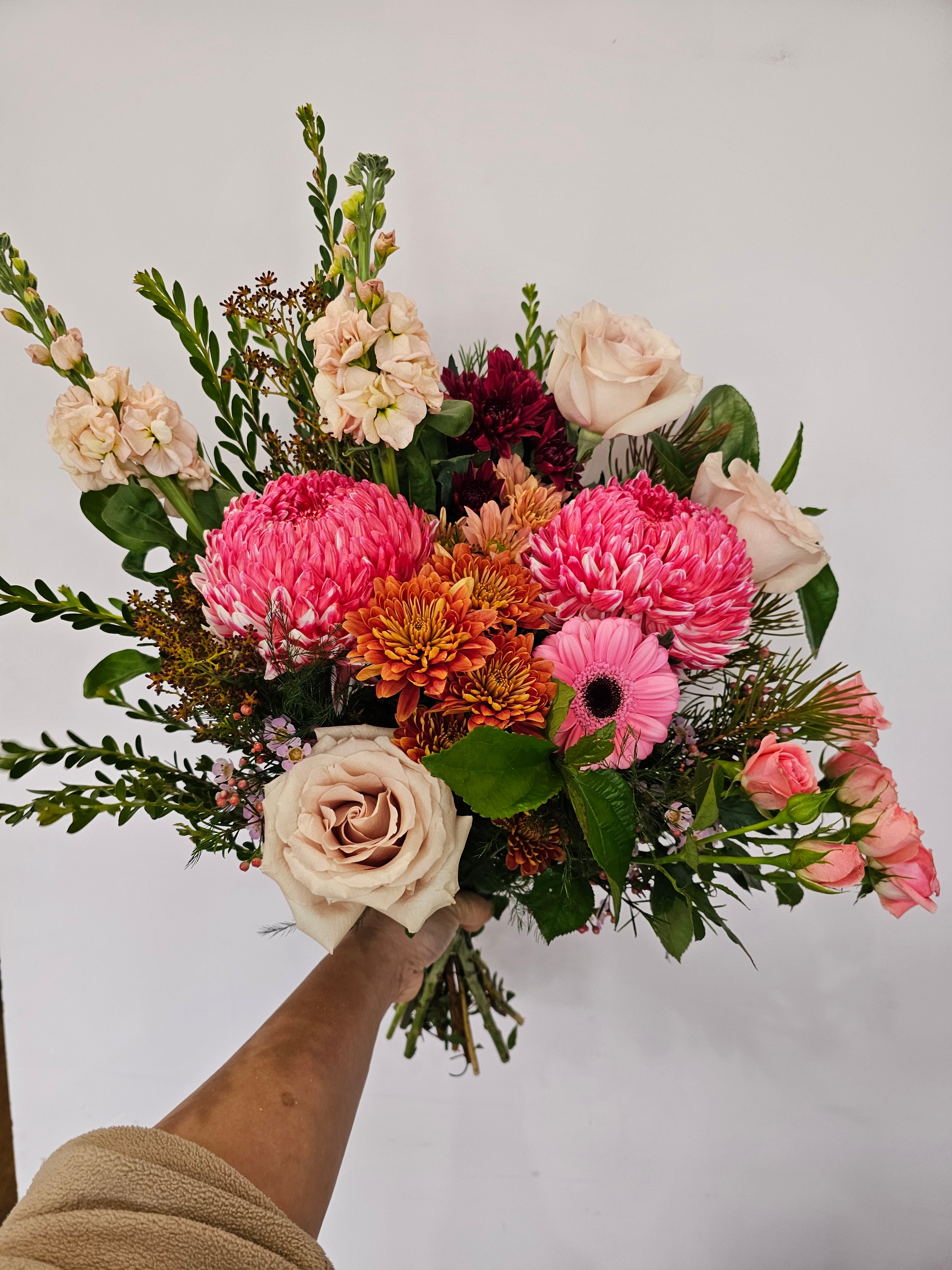 A fresh flower bouquet with bright pinks blooms and cream florals with some purple tones for same day flower delivery Perth from the Flower Boutique Perth