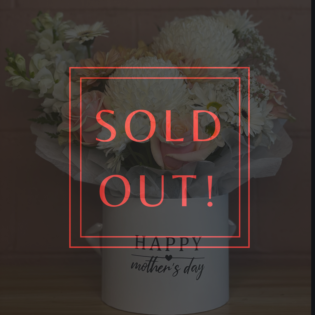 Big Love Mother’s Day flower arrangement in a black round box with 'Happy Mother’s Day' printed on it, featuring pastel pink roses, white chrysanthemums, soft pink daisies, and a vibrant hot pink bloom, styled with delicate greenery. Created by The Flower Boutique Perth.