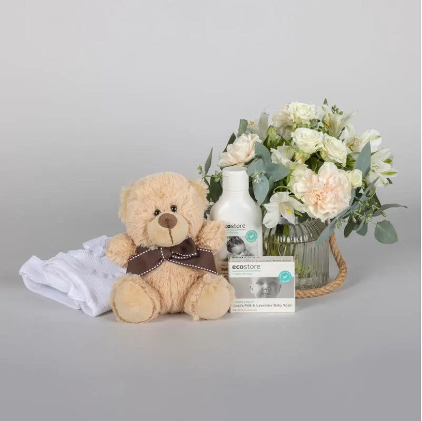 Newborn gift basket with muslin wrap, rattle and skincare — Perth WA