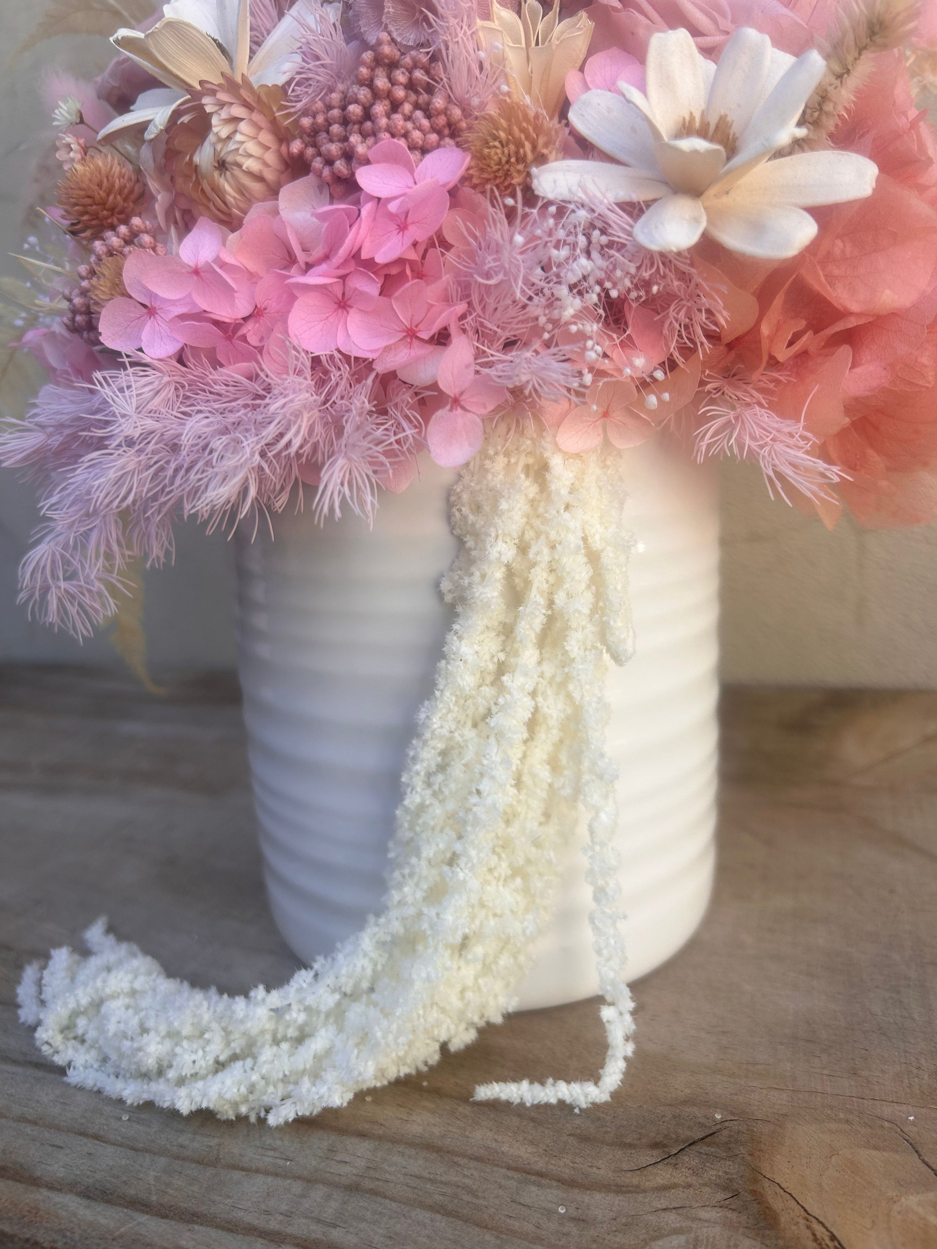 Side angle of Fairy Floss everlasting flower arrangement showing layered textures and preserved foliage.