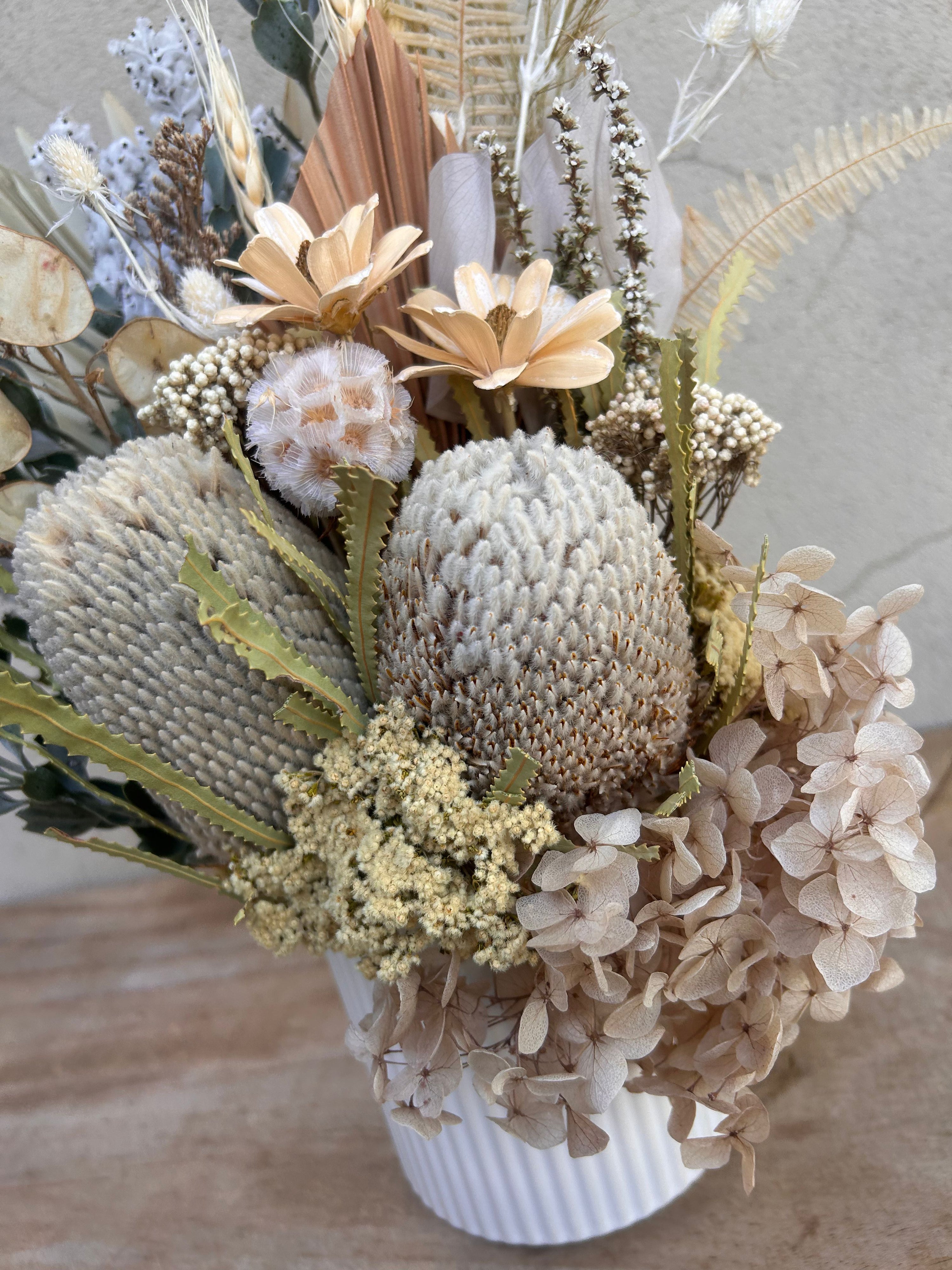 Natural dried floral arrangement styled in ceramic vase Perth