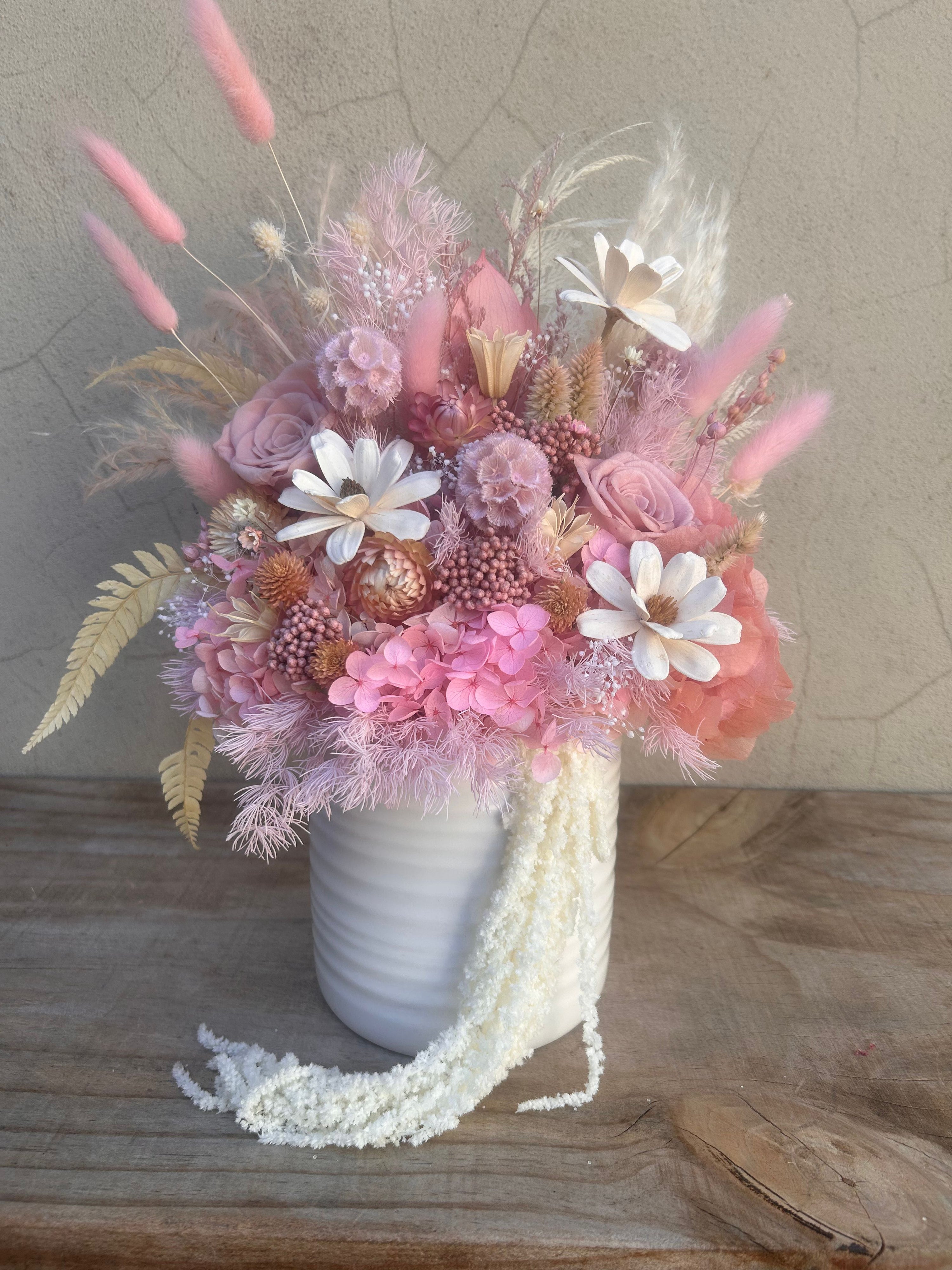 Fairy Floss Luxe dried flower arrangement in a white ceramic vase with blush pink, lilac and preserved roses.