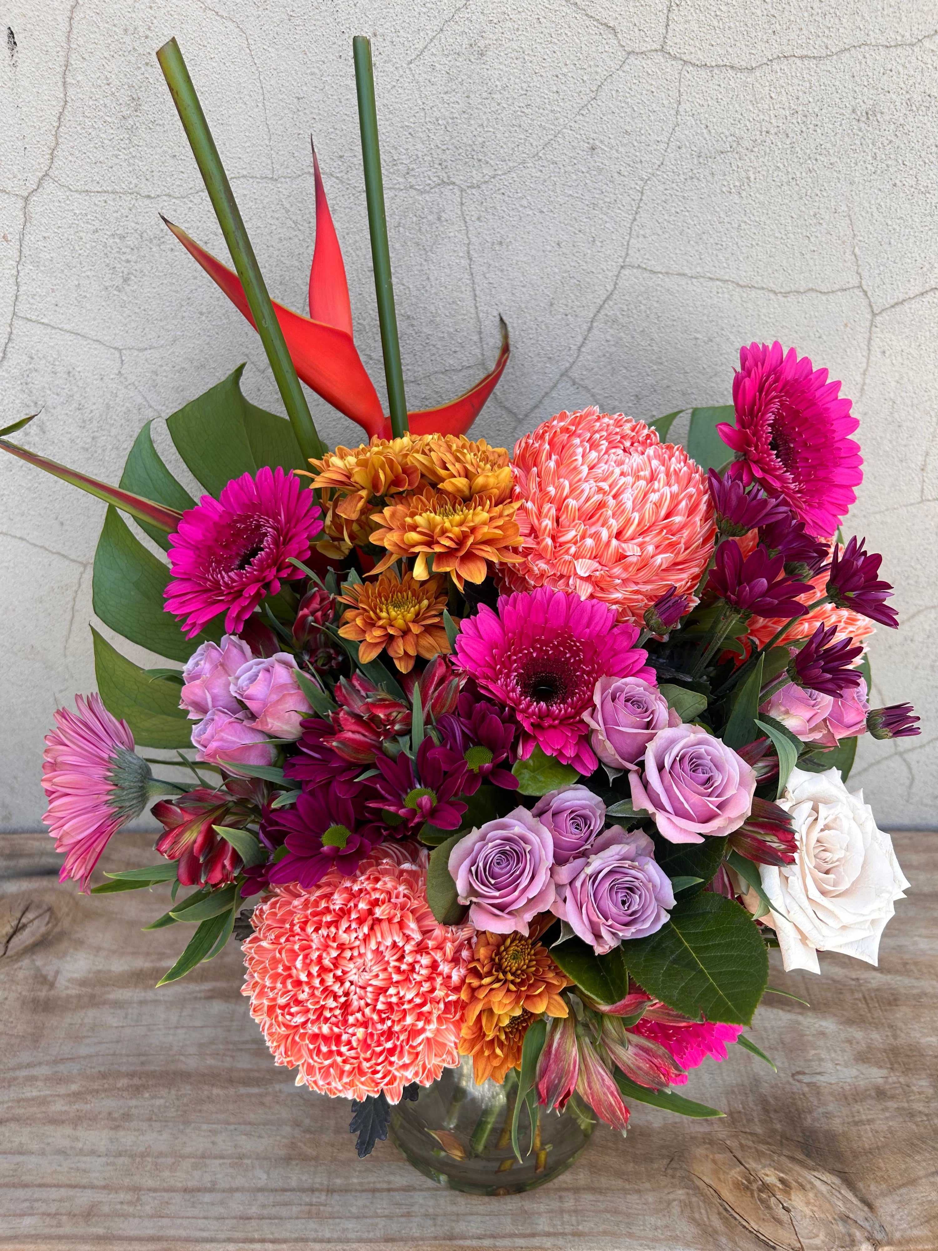 Colourful Festa Floreale vase arrangement with seasonal flowers and textured foliage