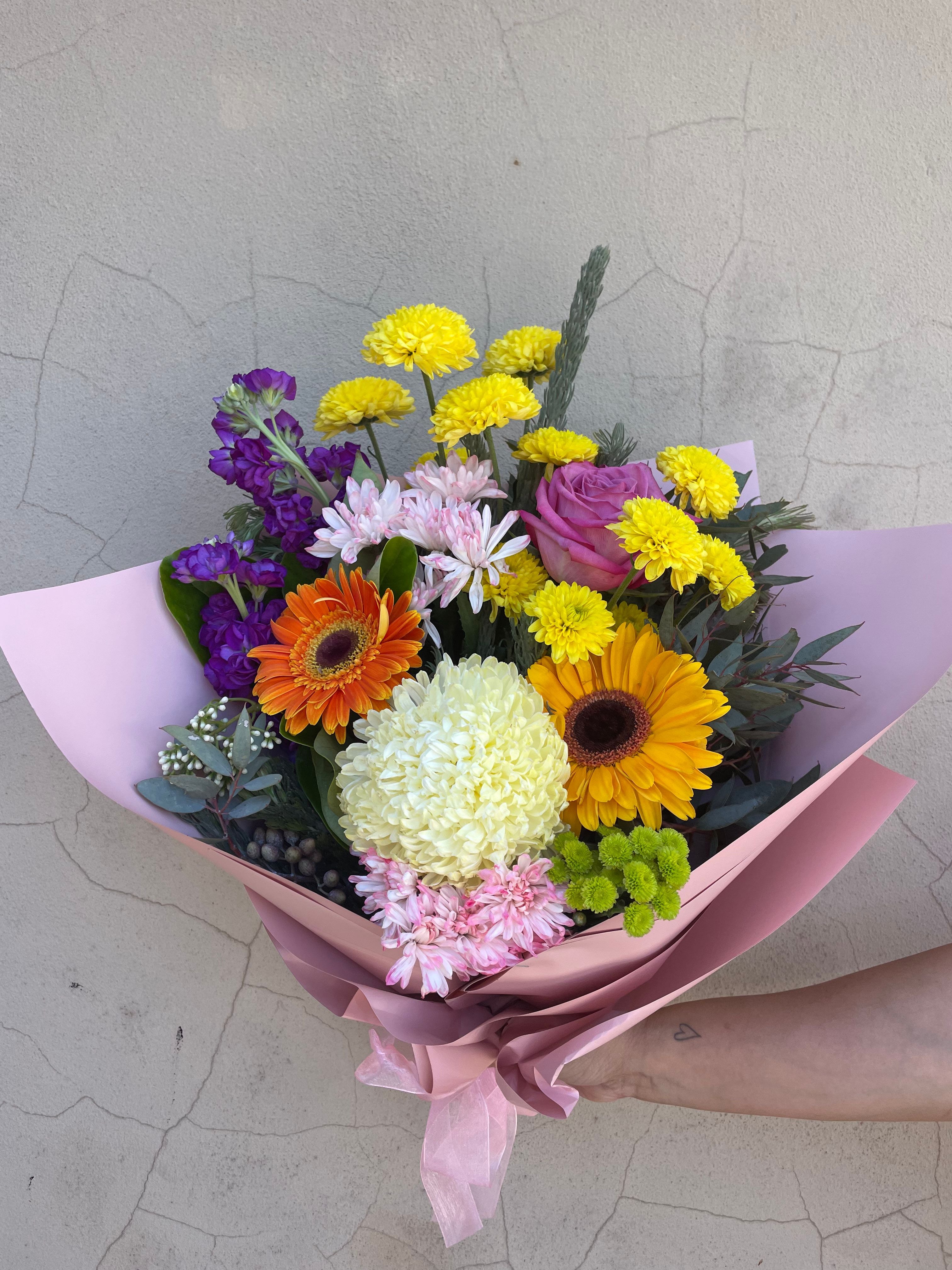 Florist Choice Flower Bouquet featuring a hand-picked selection of seasonal blooms arranged with care for any occasion. Available for same day delivery across Perth W.A 6065