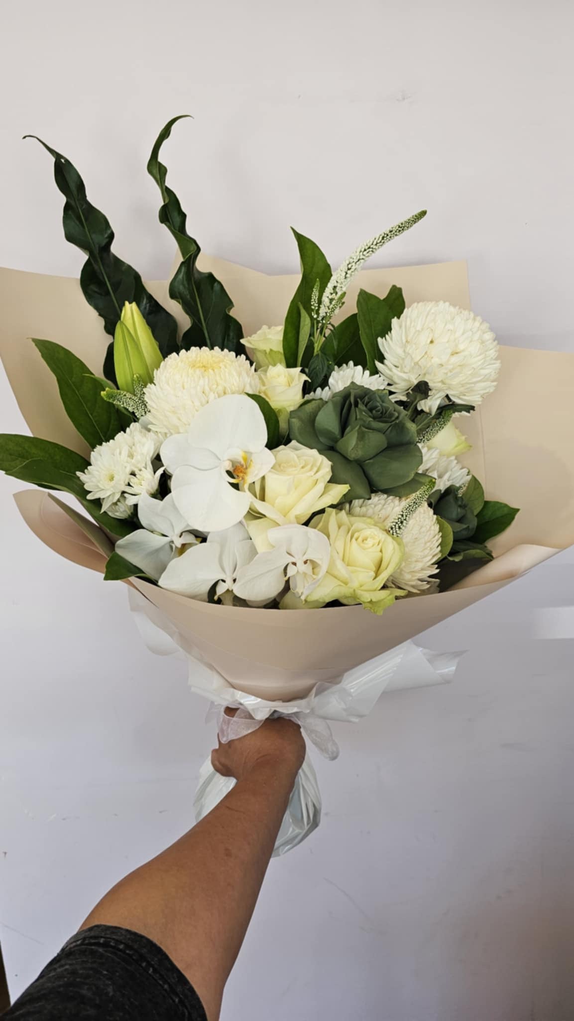 A white neutral coloured bouquet of fresh flowers for same day delivery perth from the Flower Boutique Perth. Popular as sympathy flowers and funeral flowers