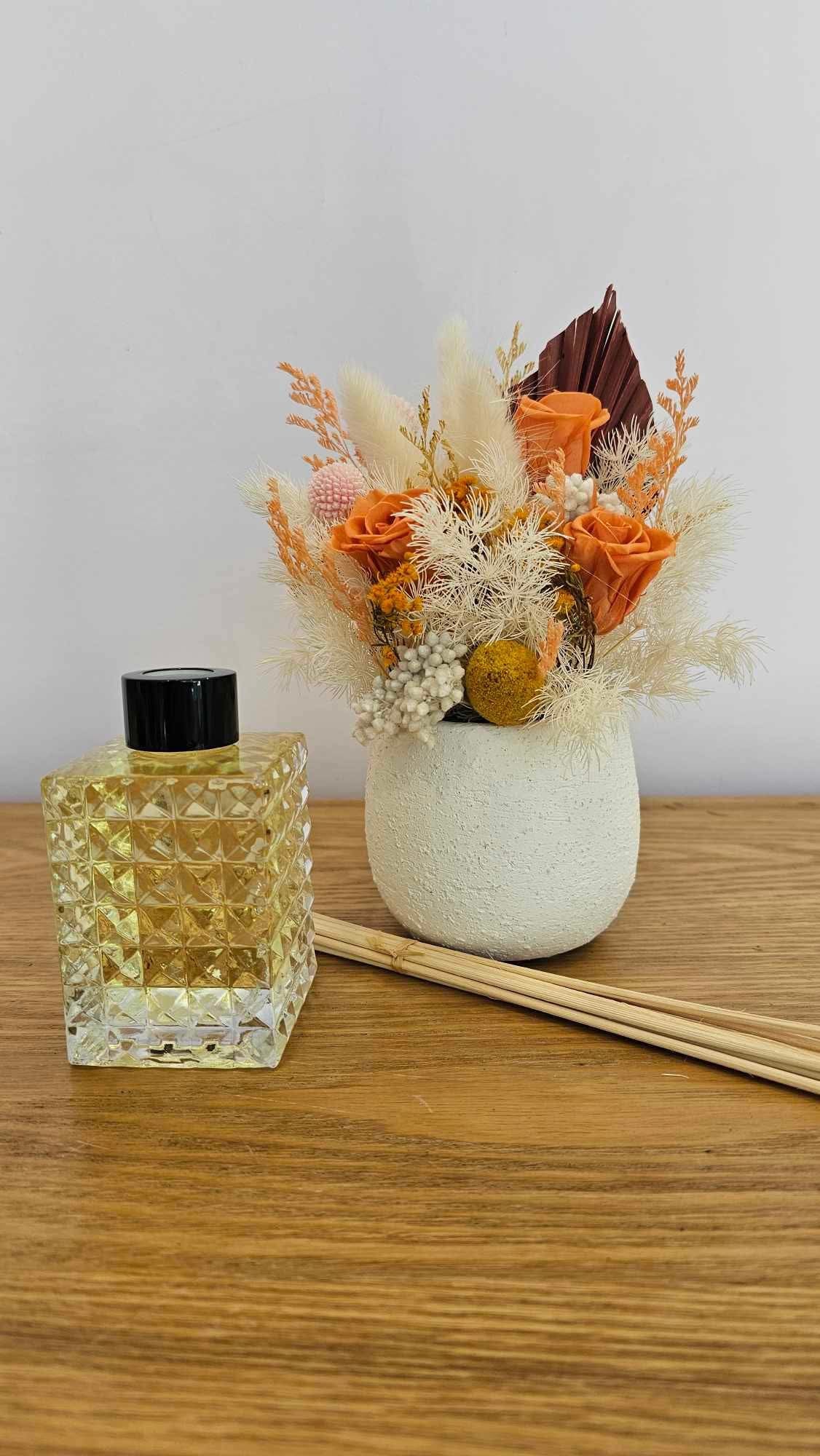 A mini preserved floral arranged alongside a caramel popcorn scented diffuser only available in-store at the Flower Boutique Perth