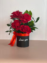 VIDA flower box with "Love You" message written on the box featuring a red ribbon and four premium Ecuadorian roses in a black keepsake box