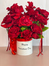 VALENTINA flower box with "happy valentines day" written on the box featuring twelve premium Ecuadorian roses in a white keepsake box.