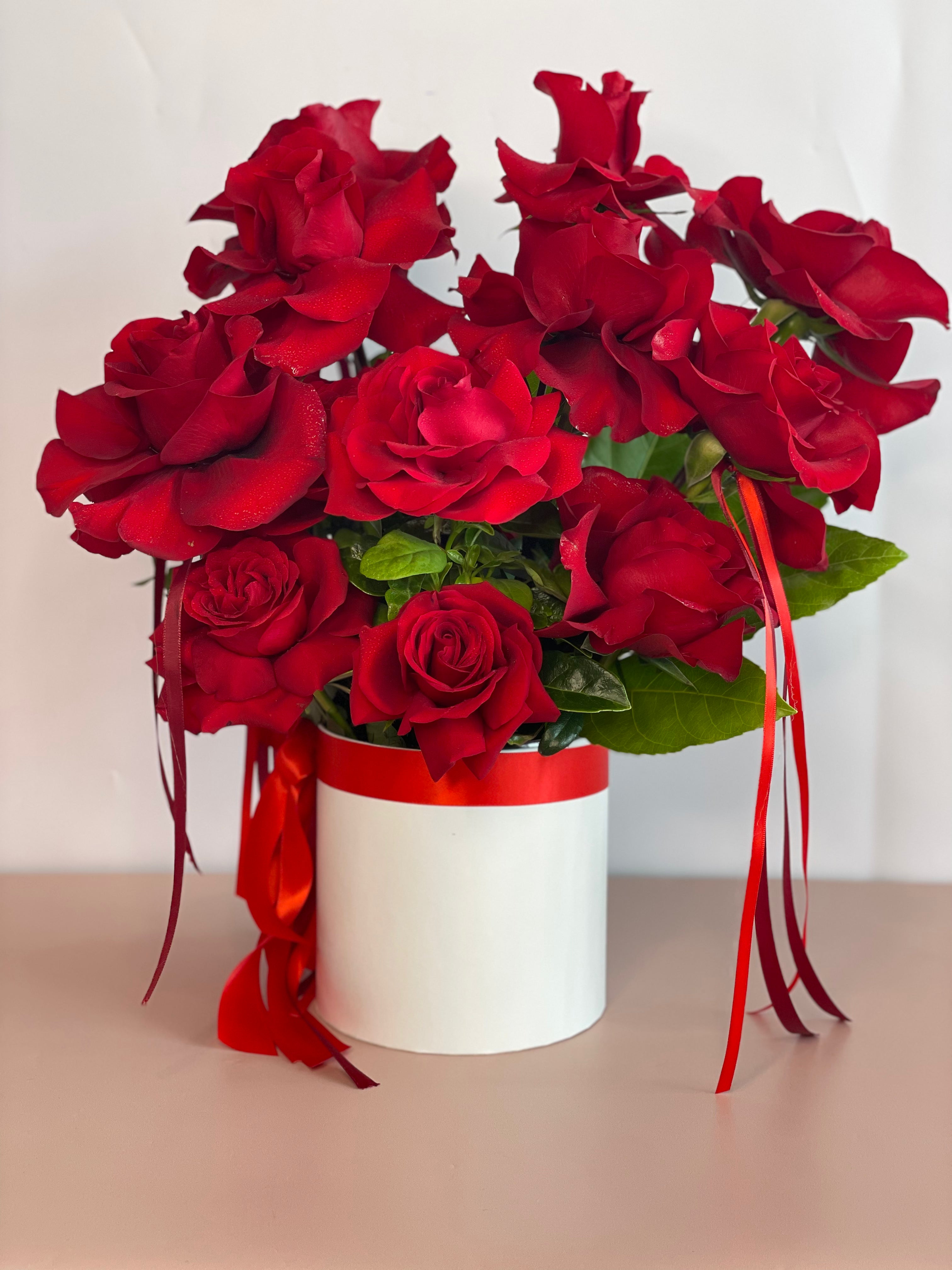 VALENTINA flower box with stunning red ribbons featuring a dozen premium Ecuadorian roses in a white keepsake box.