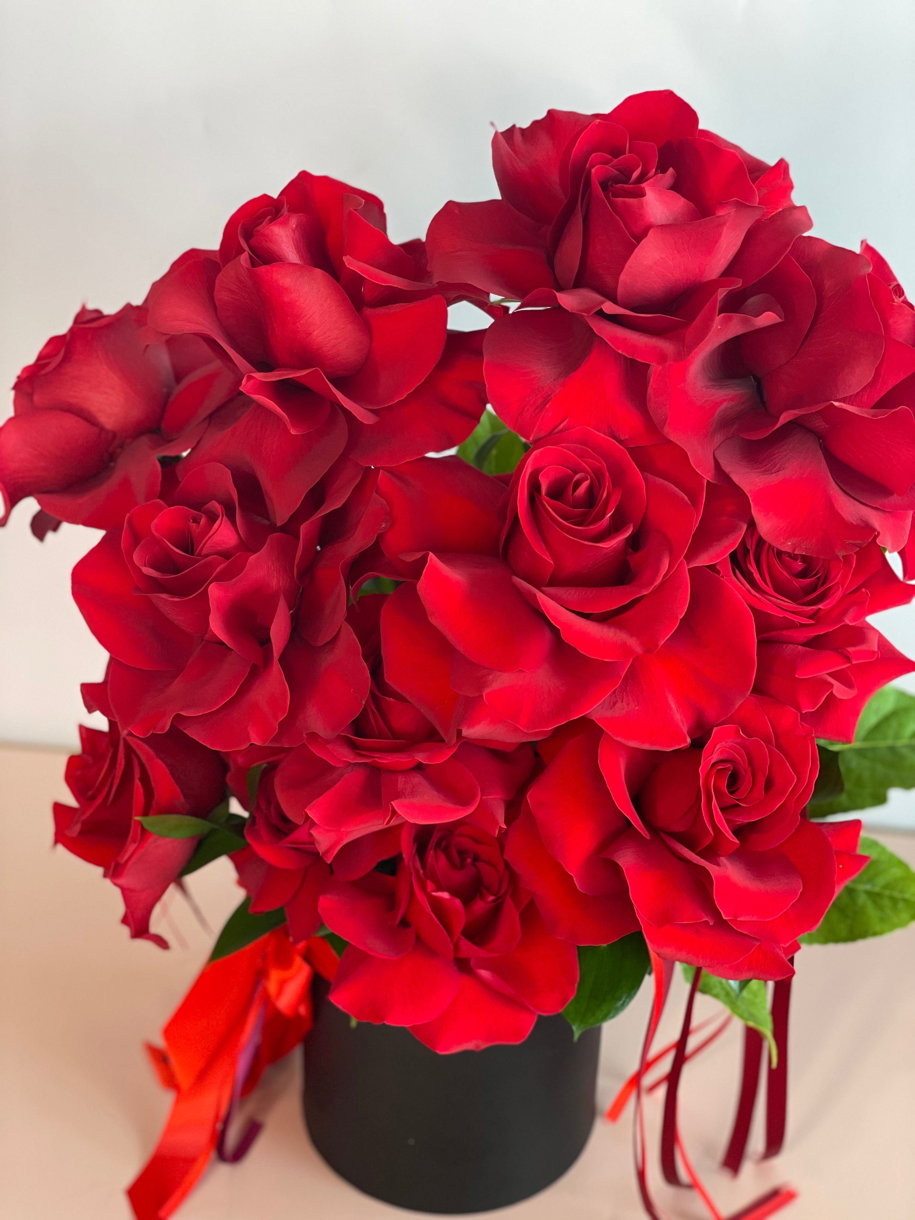 VALENTINA flower box featuring twelve premium Ecuadorian roses in a black keepsake box.