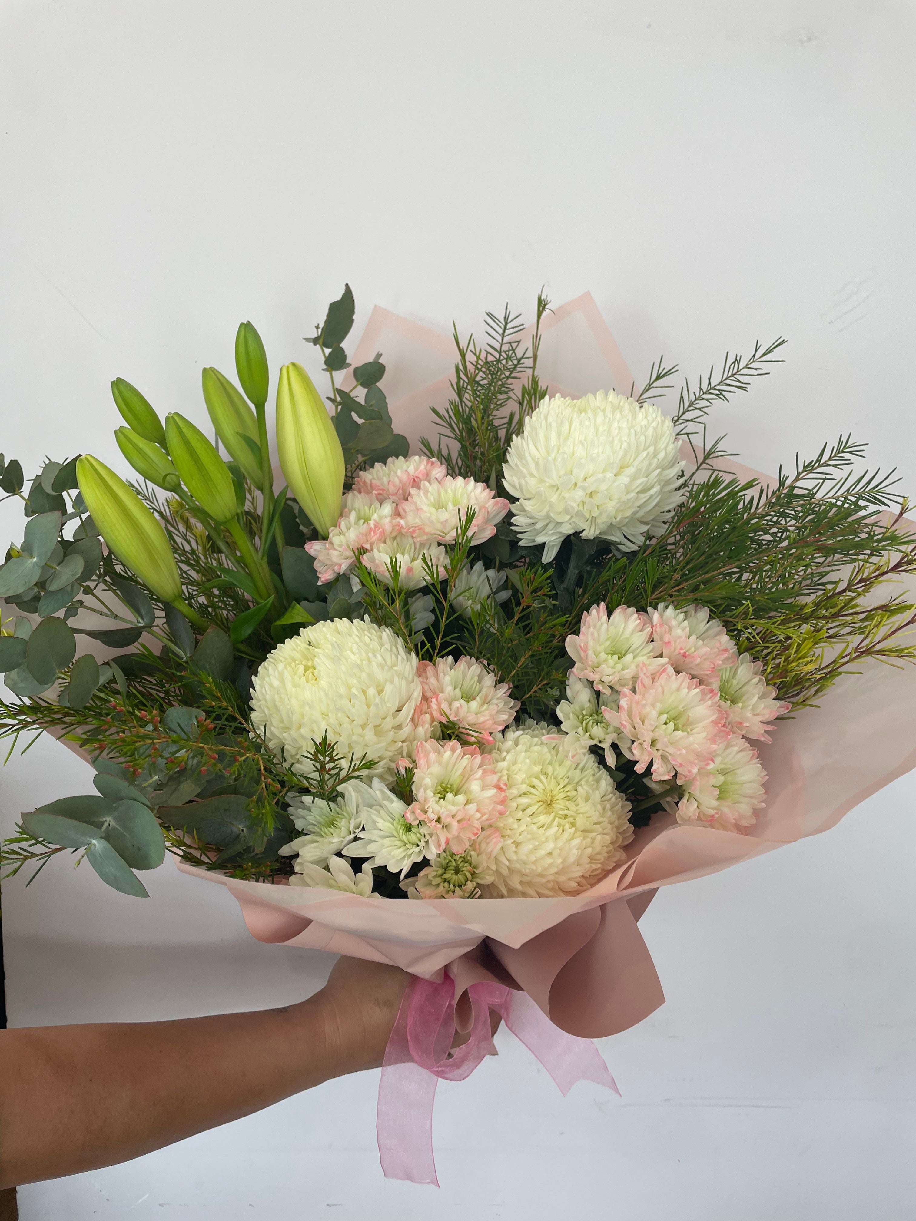 Florist's Choice Flower Bouquet featuring a hand-picked selection of seasonal blooms arranged with care for any occasion. Available for same day delivery across Perth W.A 6065
