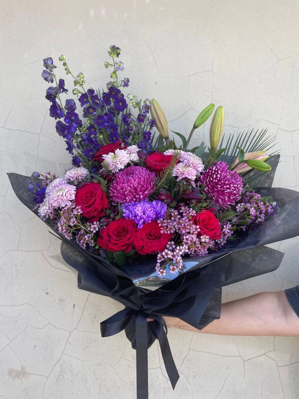Midnight Velvet bouquet featuring dark berry tones with rich reds, purples, dark pinks, and a touch of blue. Includes roses, dahlias, and lilies, available for delivery in Perth, Western Australia.
