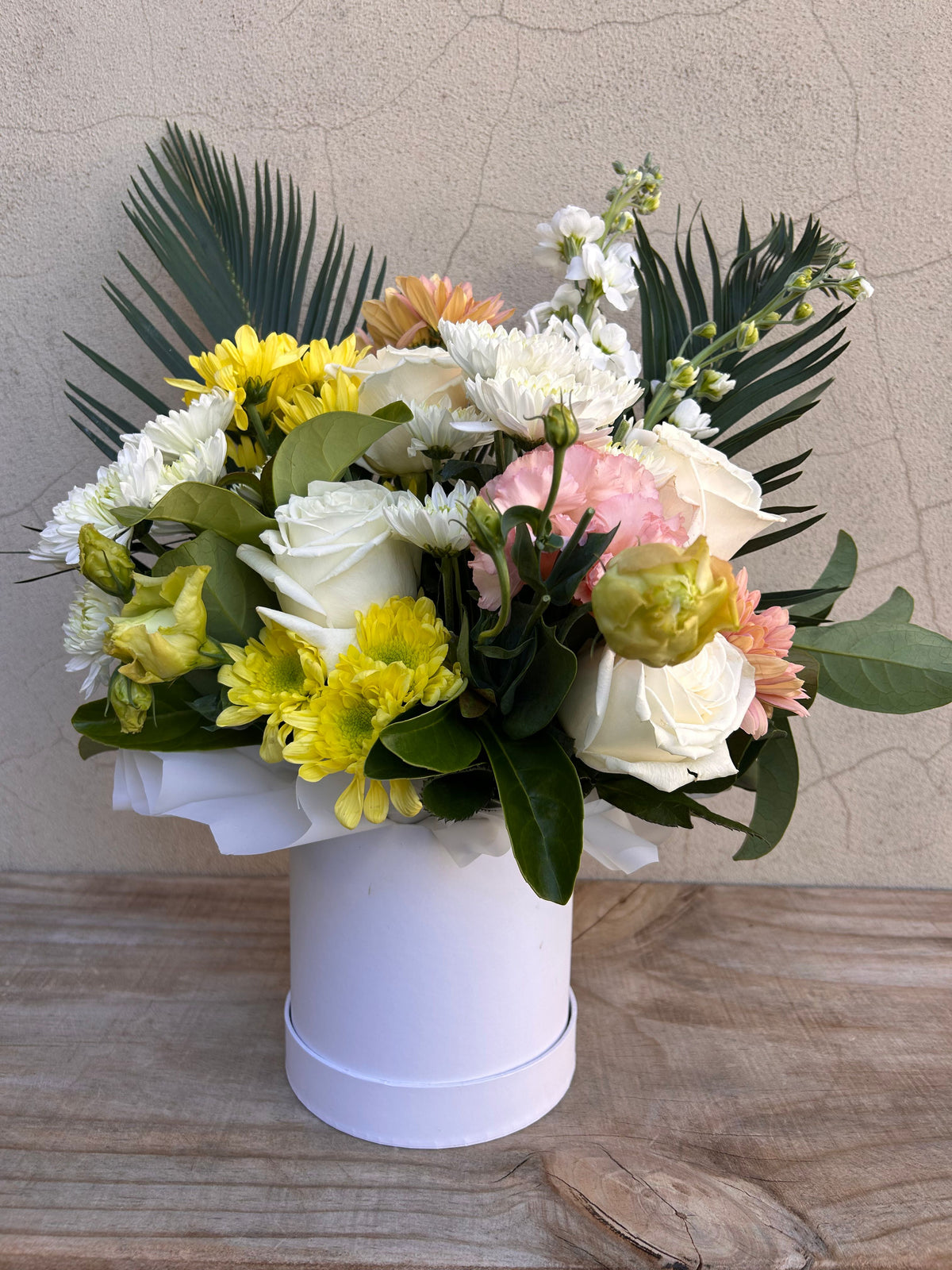 Little Love petite flower arrangement with white, yellow and blush flowers in a white hat box
