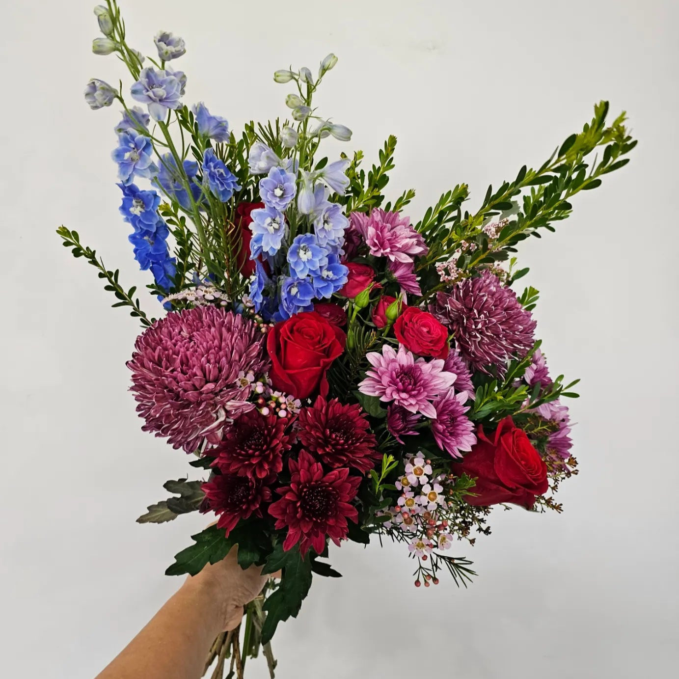 Midnight Velvet bouquet featuring dark berry tones with rich reds, purples, dark pinks, and a touch of blue. Includes roses, dahlias, and lilies, available for delivery in Perth, Western Australia.