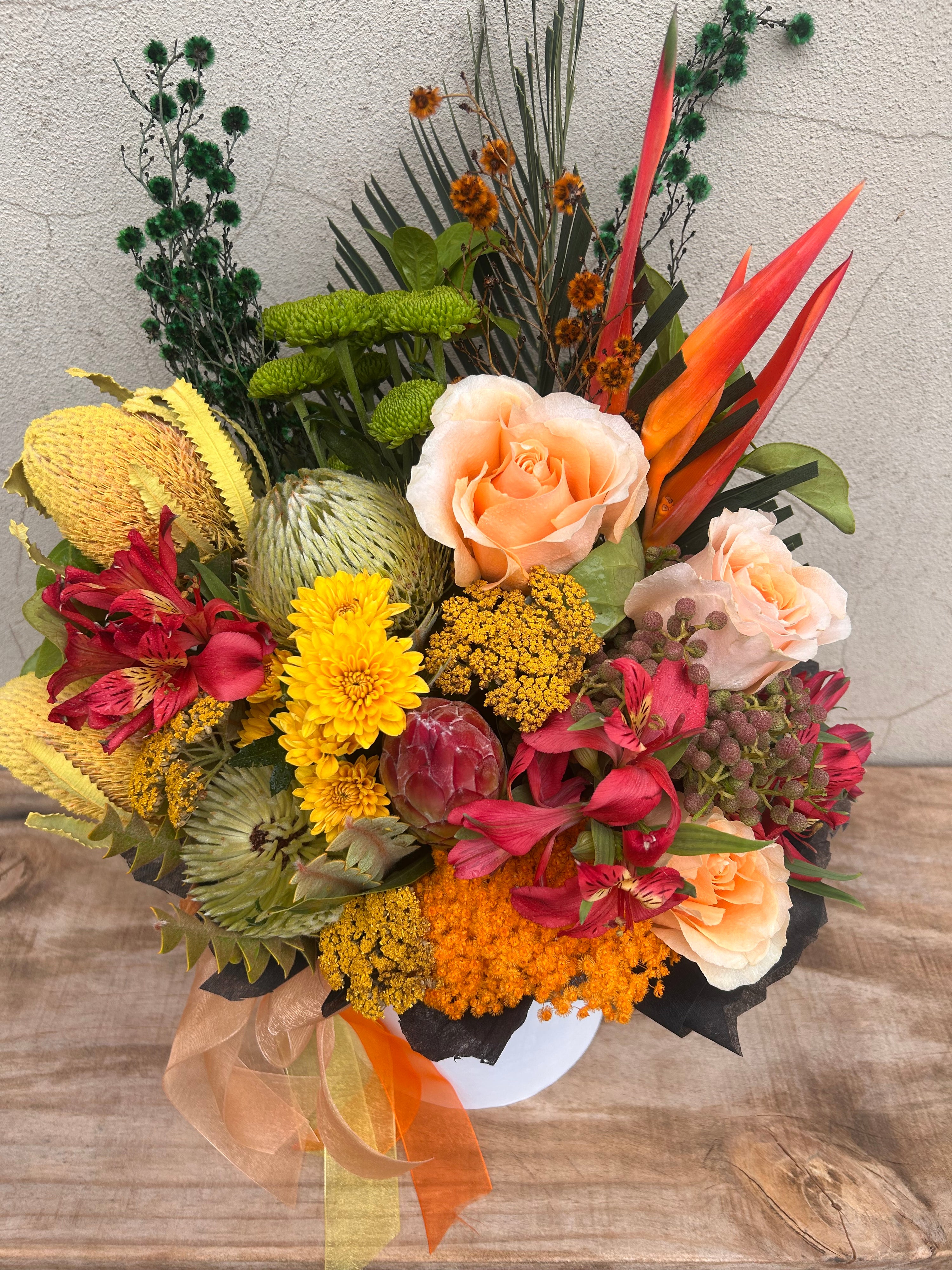 Native flower arrangement in white gift box