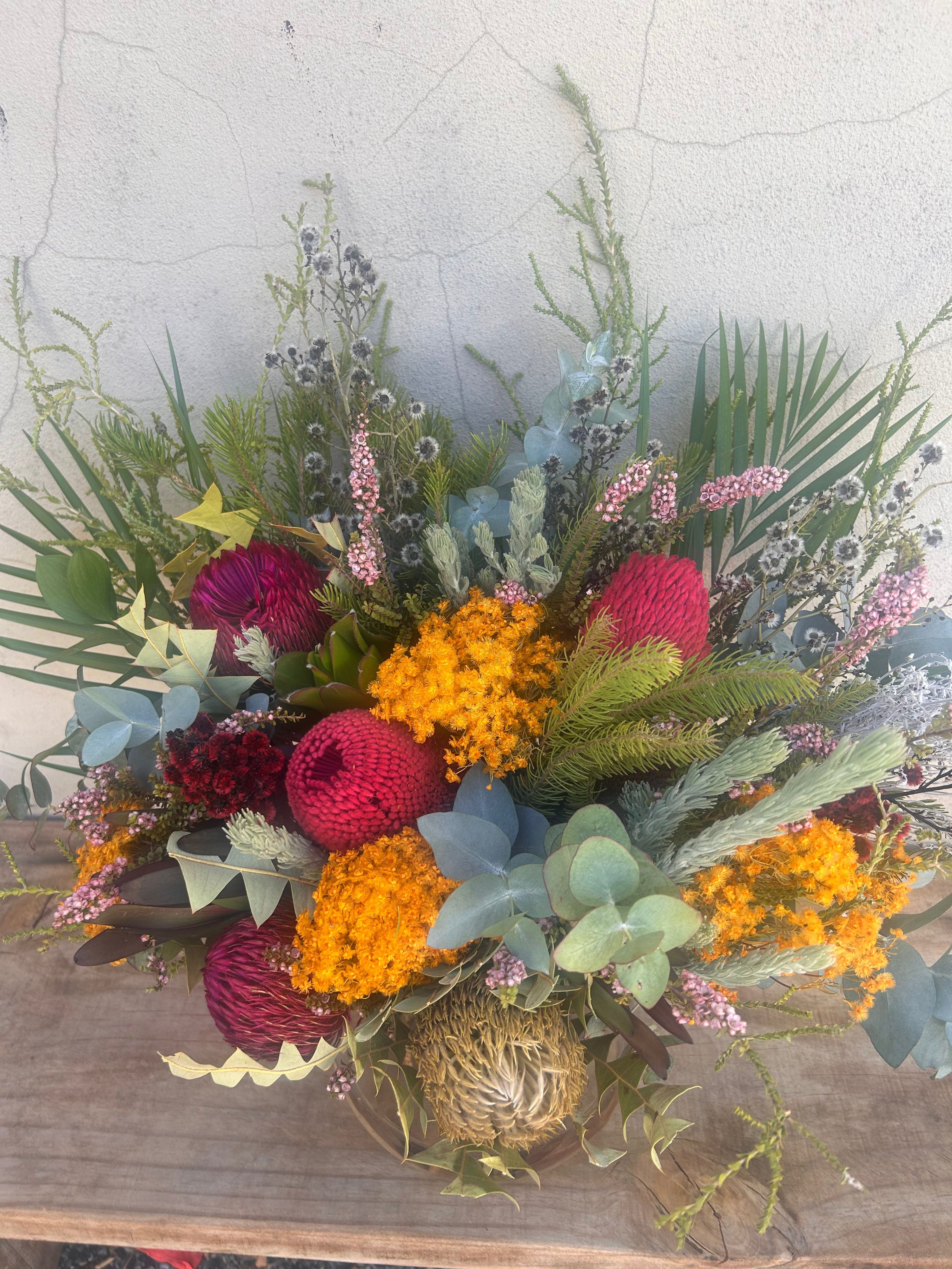 Native Luxe vase arrangement featuring premium Australian native flowers styled in a modern glass vase in Perth.