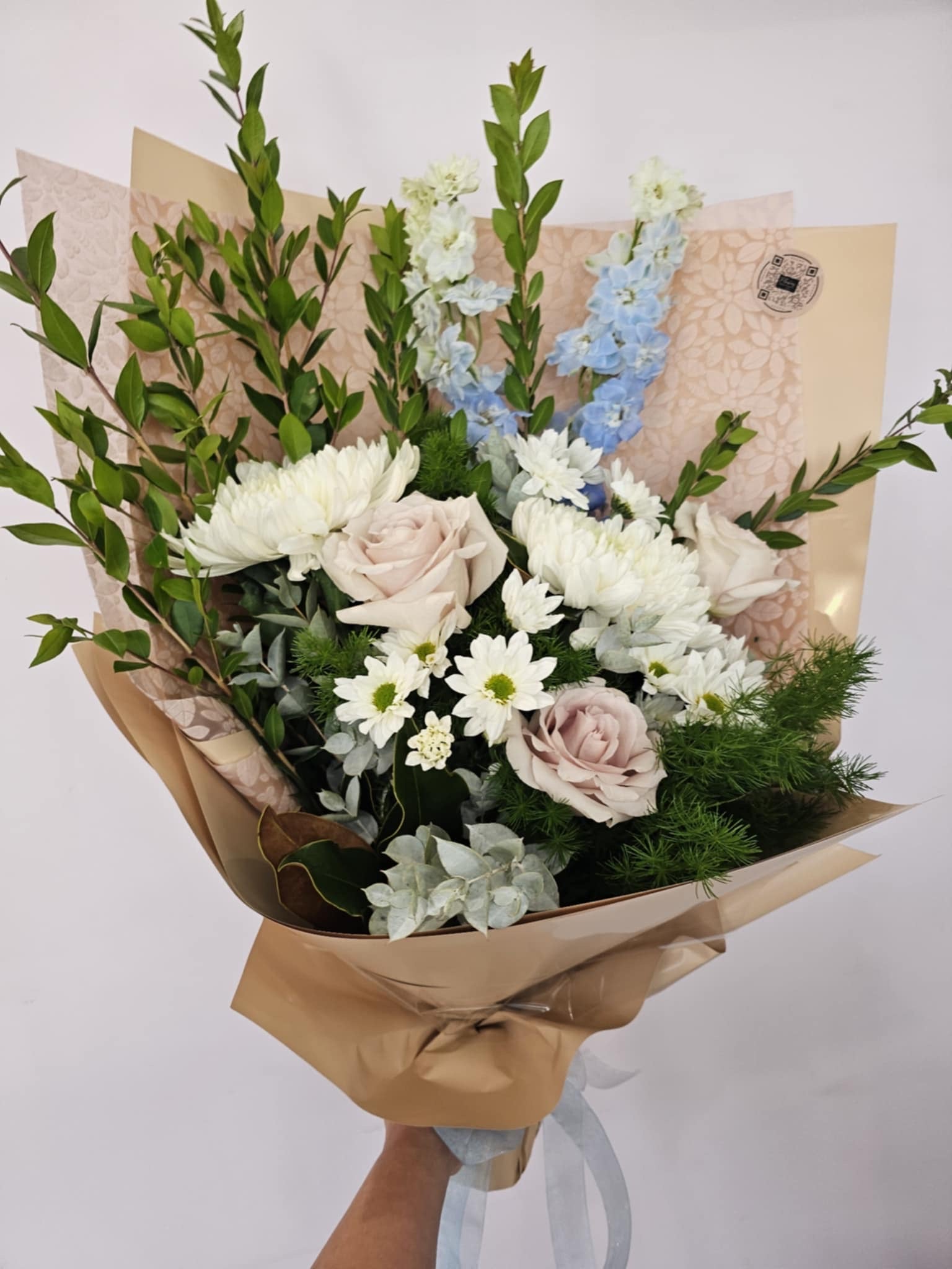 A white neutral coloured bouquet of fresh flowers for same day delivery perth from the Flower Boutique Perth. Popular as sympathy flowers and funeral flowers