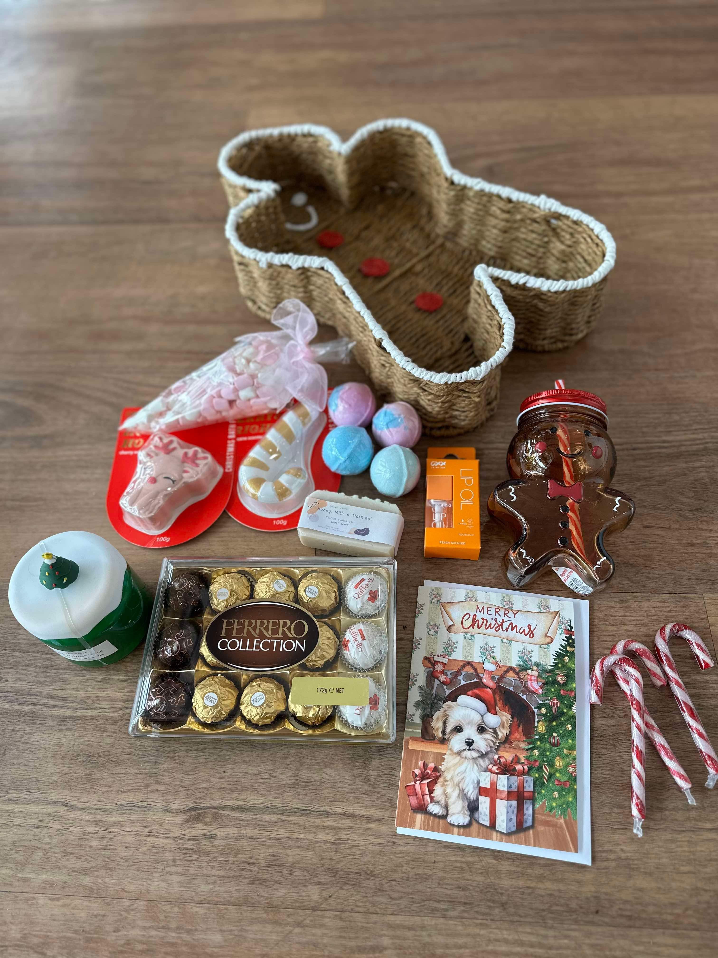 A beautifully presented Christmas hamper inside a ginger bread man shaped basket filled with festive goodies and artisanal treats, perfect for holiday gifting on it's own or as an add on to your flower order for pick up from our Ashby store or delivery across Perth.