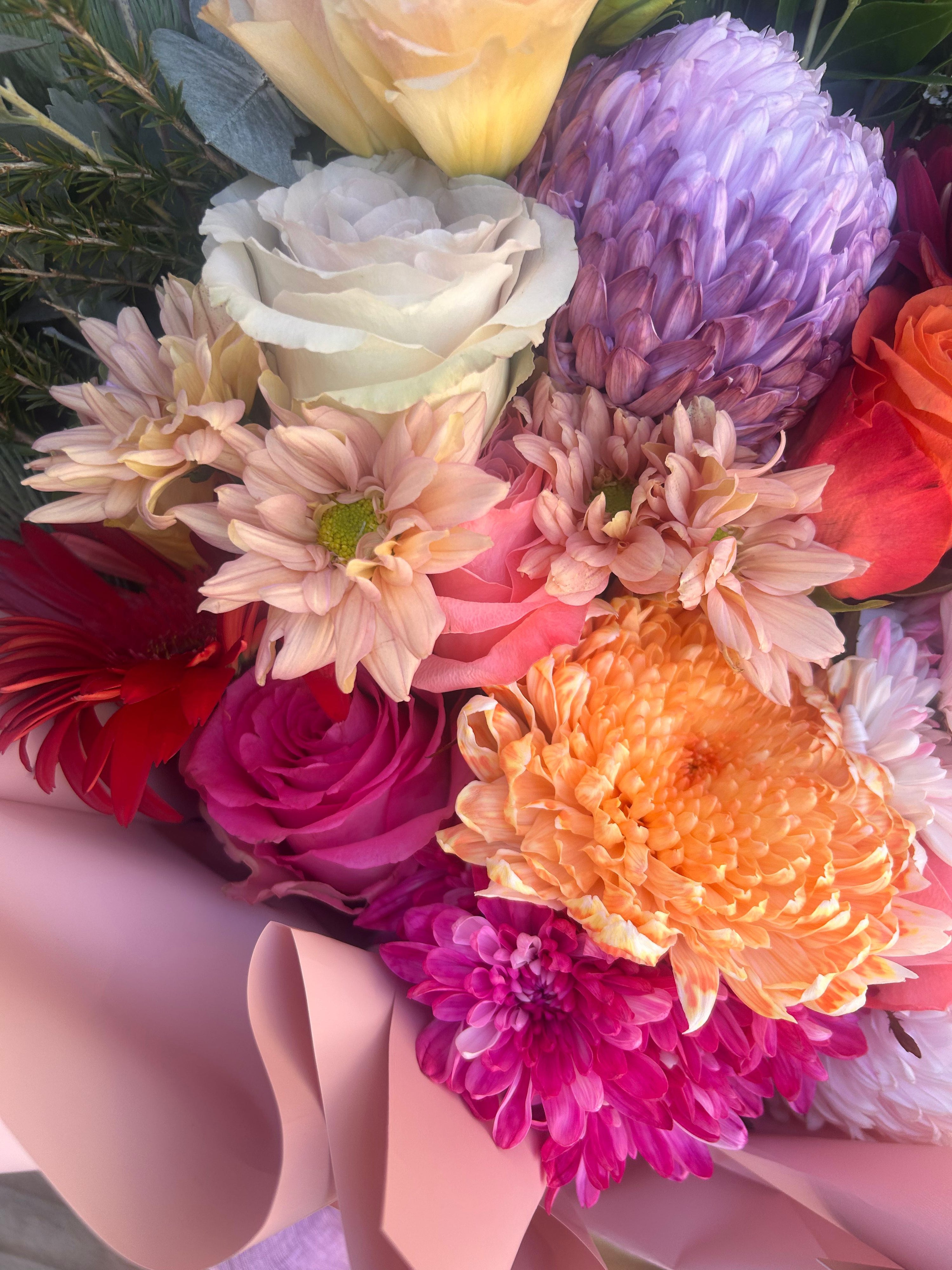 Vibrant pink flower arrangement wrapped bouquet, perfect for gifting and celebrations