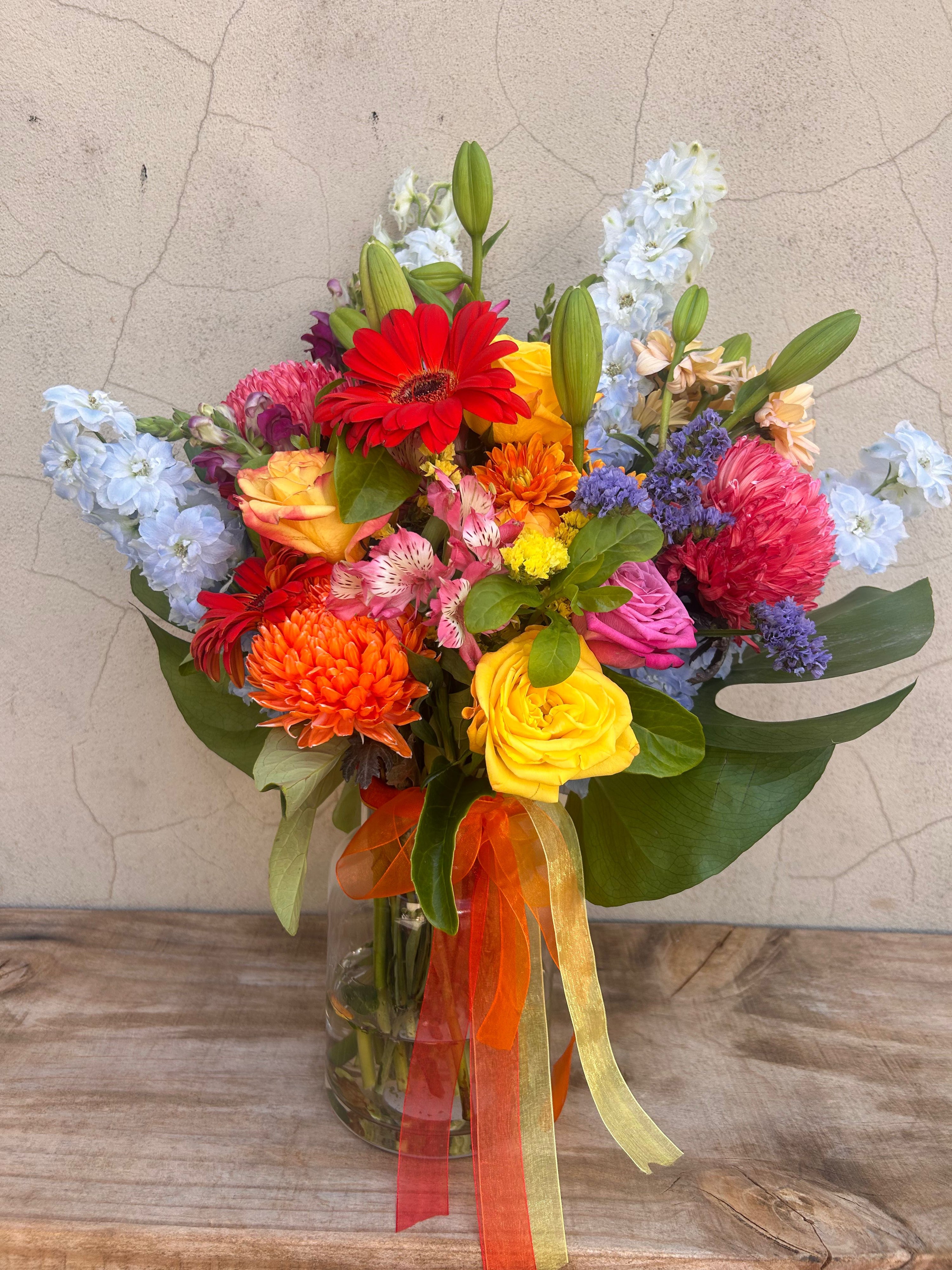 Premium Elysian Garden vase arrangement featuring bright seasonal flowers including roses, chrysanthemums and gerberas in Perth.