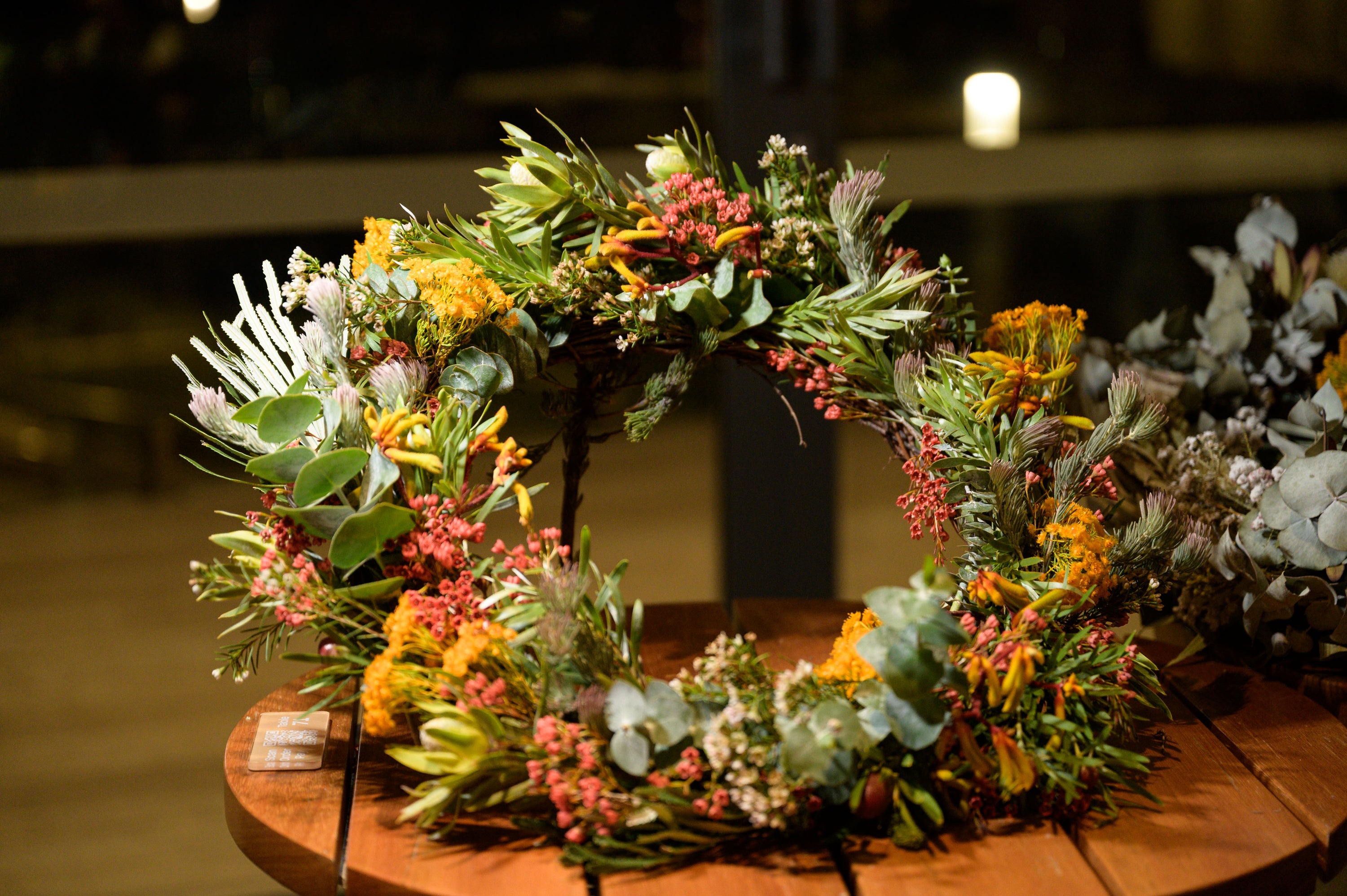 A beautifully handcrafted Christmas wreath made from fresh and dried seasonal greenery, decorated with festive ornaments and ribbons, perfect for adding a personal touch to holiday home decor. Crafted at The Flower Boutique's Christmas Wreath Workshop in Perth.